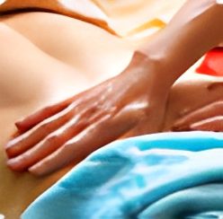 Hand giving a relaxing back massage